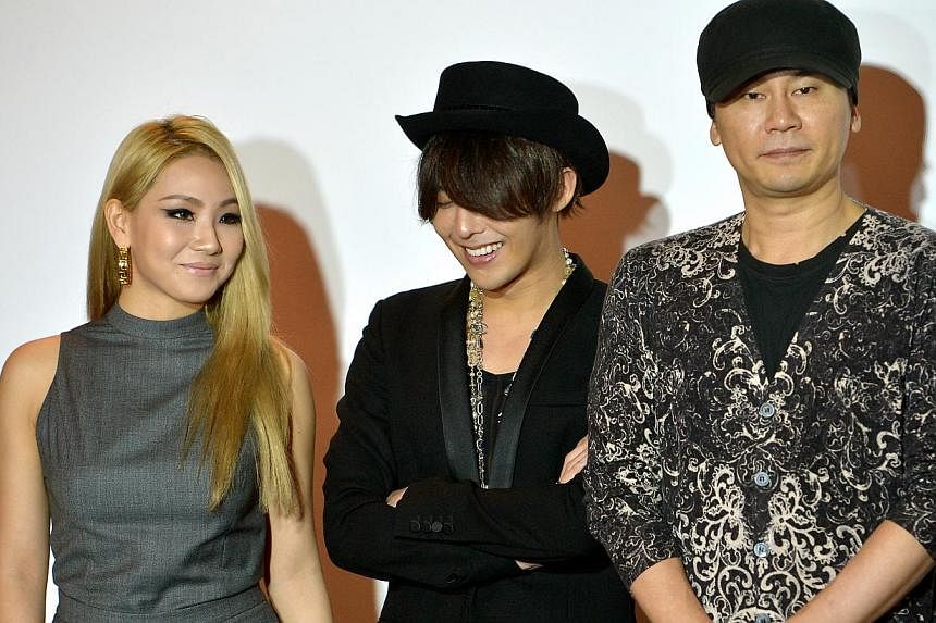 (From left) CL of K-pop girl group 2NE1, G-Dragon and YG Entertainment founder and chairman Yang Hyun Suk. -- ST PHOTO: KUA CHEE SIONG