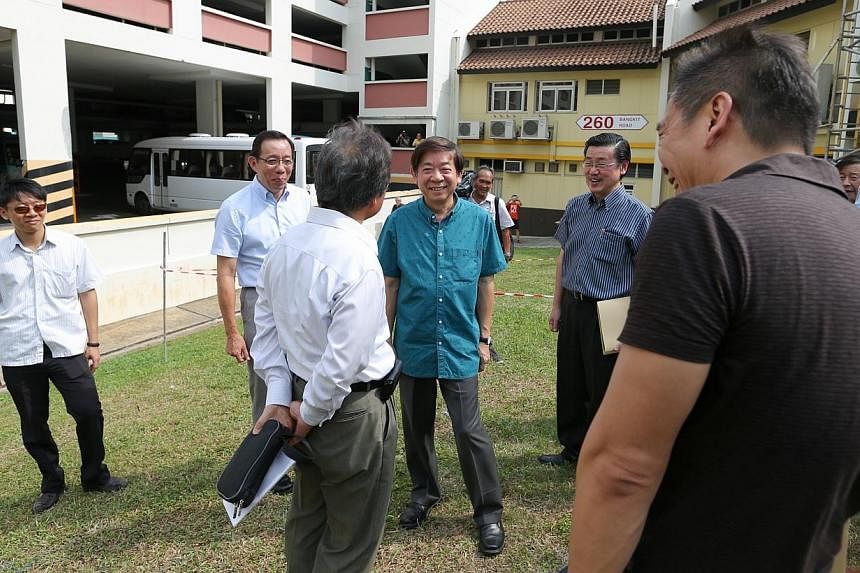 Minister Khaw Boon Wan and other guests were at the site where the mechanised carpark will eventually be built at Blk 259A Bukit Panjang Ring Road.&nbsp;-- ST PHOTO: ONG WEE JIN
