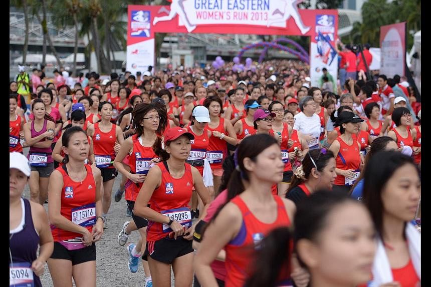 Participants having fun at the Illumi Run and at the Great Eastern Women’s Run (above) last year. -- PHOTO: LIM SIN THAI
