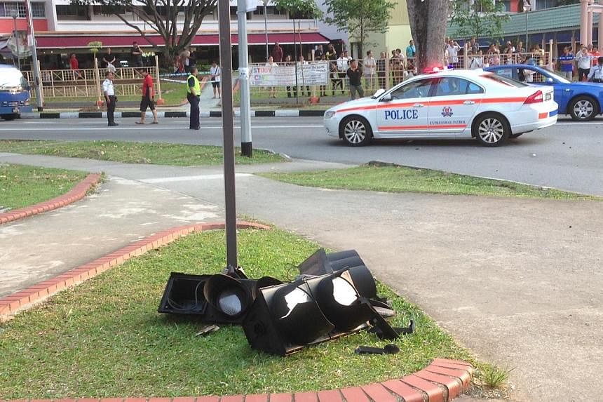 A 57-year-old man was killed after he was hit by a car while waiting at the traffic junction along Tampines Street 11. A traffic light was also smashed from the impact. The car hit two other vehicles too.&nbsp;--&nbsp;ST PHOTO: LIM YI HAN&nbsp;