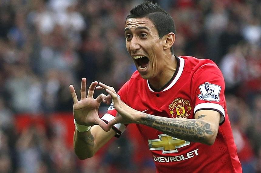 Manchester United's Angel Di Maria celebrates after scoring a goal against Queens Park Rangers during their English Premier League match at Old Trafford on Sept 14, 2014. -- PHOTO: REUTERS
