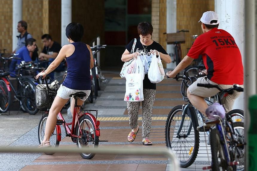 There are many cyclists in Bedok Town Centre which is a popular shopping precinct with high pedestrian traffic. -- PHOTO: ST FILE