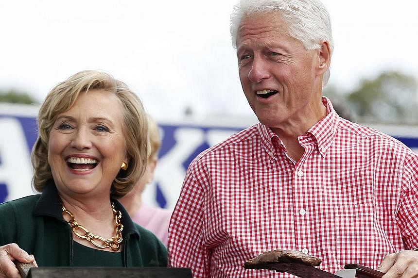 Former US Secretary of State Hillary Clinton and former president Bill Clinton in Iowa for an annual "Steak Fry" hosted by retiring Democratic Senator Tom Harkin on Sept 14, 2014. -- PHOTO: REUTERS