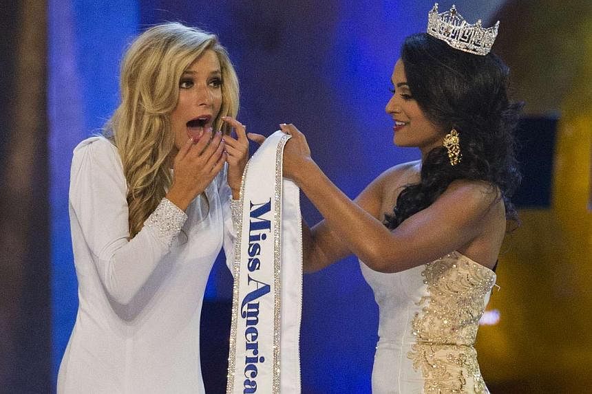 Miss New York Kira Kazantsev (left) reacts next to Miss America 2014 Nina Davuluri after being announced as the winner of the 2015 Miss America Competition in Atlantic City, New Jersey on Sept 14, 2014. -- PHOTO: REUTERS