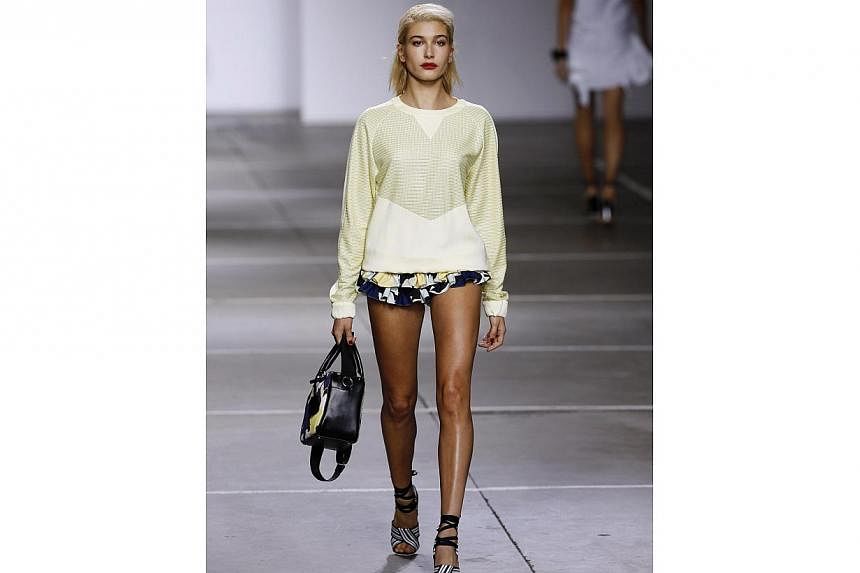 Model Hailey Baldwin presents a creation from the Topshop Unique Spring/Summer 2015 collection during London Fashion Week on Sept 14, 2014. -- PHOTO: REUTERS