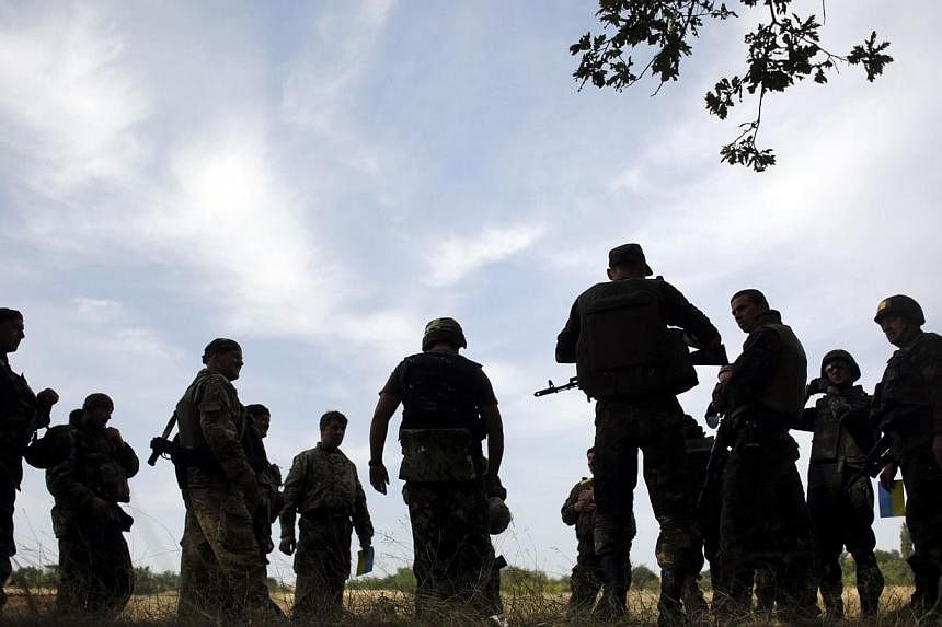US-led military exercises involving 15 countries were set to begin in Ukraine on Monday, as fighting rumbles on in the restive east between government forces and pro-Russian rebels in violation of a ceasefire. -- PHOTO: AFP
