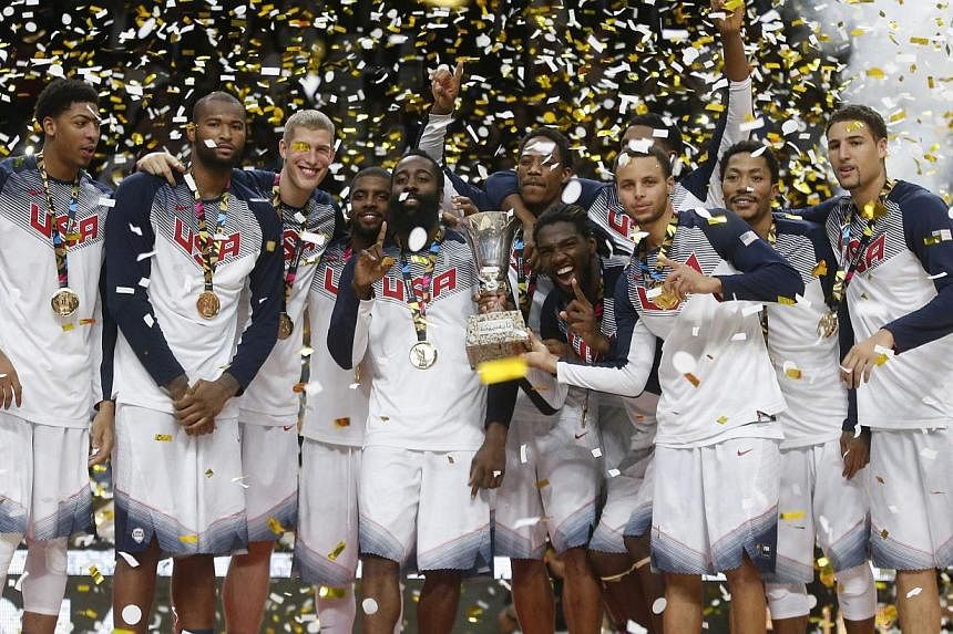 US players celebrate their victory over Serbia after their Basketball World Cup final game in Madrid on Sept 14, 2014. -- PHOTO: REUTERS