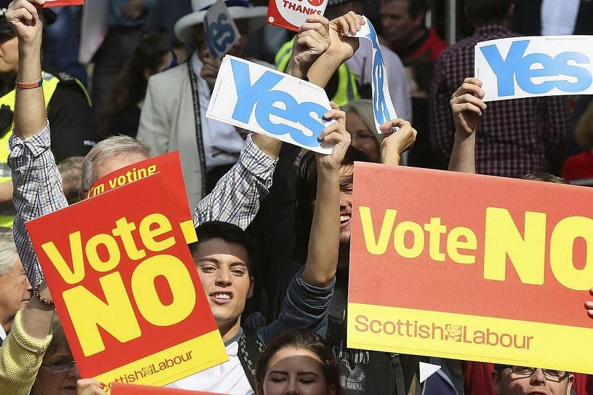 "Yes" campaign supporters try to disrupt a gathering of a "No" campaign rally that Labour Party leader Ed Miliband addressed, in Glasgow, on Sept 11, 2014. -- PHOTO: REUTERS