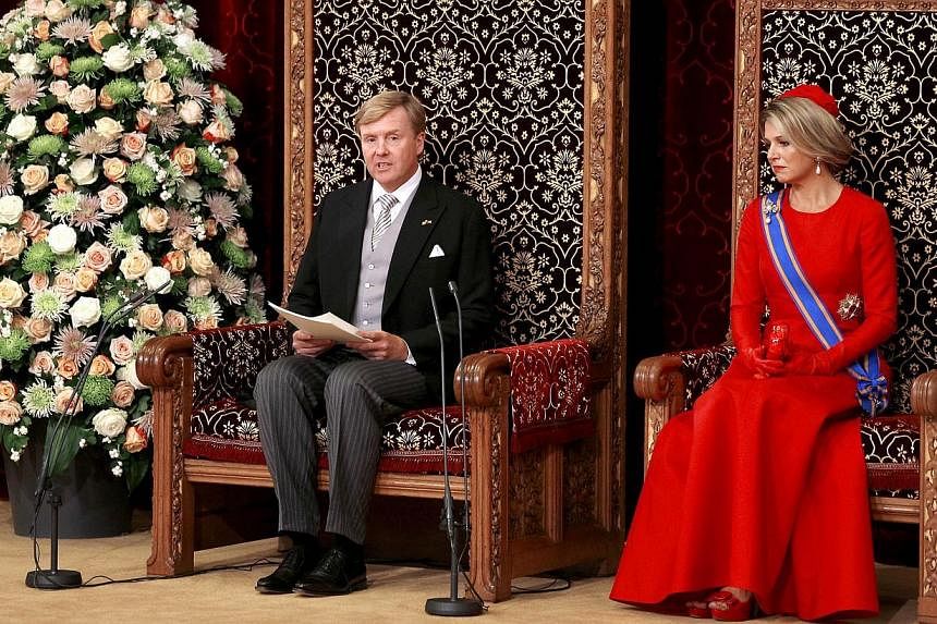 Dutch King Willem-Alexander (left) addresses the Dutch Senate and House of Representatives from the throne in the Hall of Knights next to Queen Maxima, on Sept 16, 2014, in The Hague, the Netherlands.&nbsp;The Netherlands is to increase defence spend
