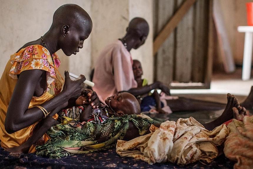 Malnourished children receive treatment at the Leer Hospital, South Sudan, on July 7, 2014.&nbsp;The number of hungry people in the world has fallen by more than 100 million in the past decade but 805 million people, or one in nine, still do not have