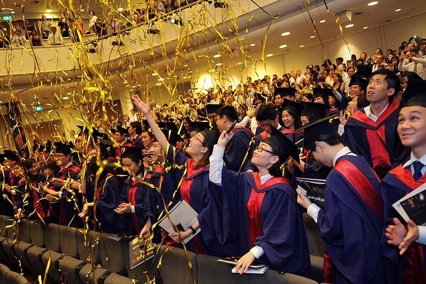 National University of Singapore students at their graduation ceremony in 2011. -- PHOTO: ST FILE