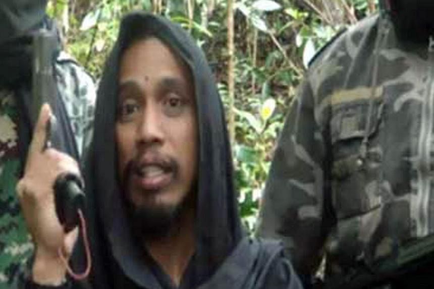 The four Uighurs nabbed in Sulawesi had tried to contact wanted militant Santoso (above).