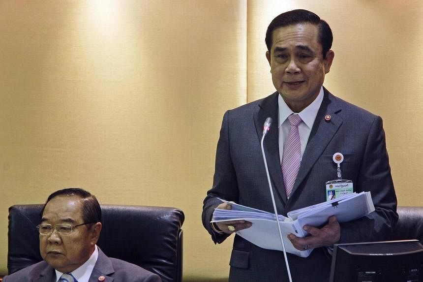 Thailand's prime minister Prayuth Chan-ocha (right) said on Tuesday the country was not always as safe for foreign visitors as their homelands, after the murder of two British tourists dealt a blow to the South-east Asian nation's image. -- PHOTO: RE