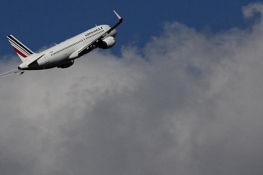 An Air France aircraft takes-off at the Charles-de-Gaulle airport, near Paris, on Sept 16, 2014.&nbsp;The French government called for an end to the Air France pilots' strike, now in its third day, as the dispute over cost cuts threatened 60 per cent