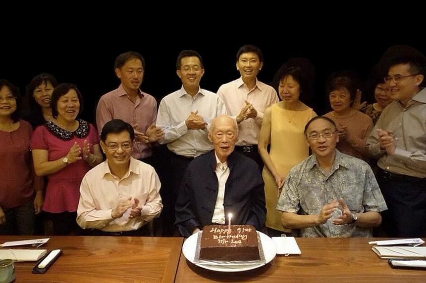 Mr Lee Kuan Yew celebrating his 91st birthday on 16 September 2014 with current and former staff. (Seated, from left) Education Minister Heng Swee Keat and Singapore Press Holdings chief executive Alan Chan, who served as Mr Lee's principal private s