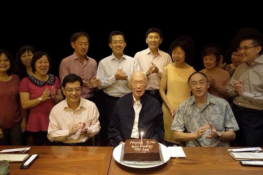 Mr Lee Kuan Yew celebrating his 91st birthday yesterday with current and former staff such as (seated, from left) Education Minister Heng Swee Keat, his principal private secretary from 1997 to 2000; and Singapore Press Holdings chief executive Alan 