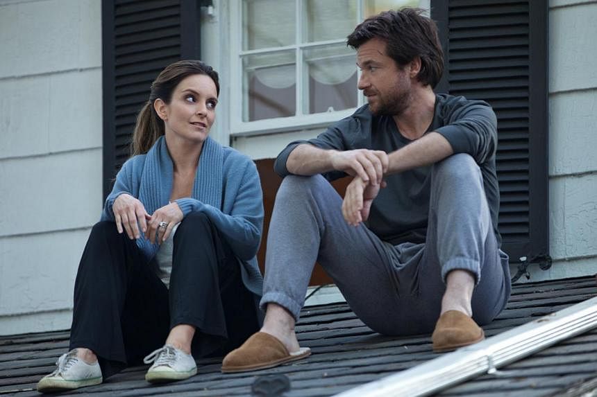 Actor Jason Bateman (with Tina Fey in This Is Where I Leave You) is known for his dry sense of humour which he puts to good use in his roles. -- PHOTOS: WARNER BROS, AGENCE FRANCE-PRESSE