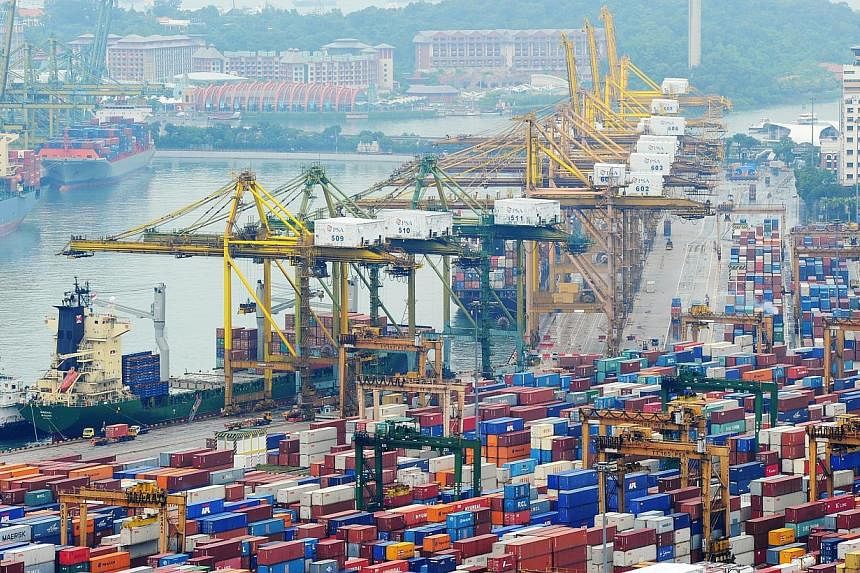 Exports from Singapore jumped last month, rebounding from a decline in previous months and beating forecasts. -- PHOTO: ST FILE