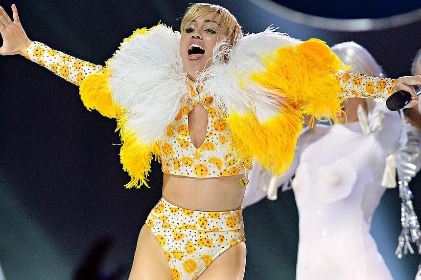 US singer Miley Cyrus performance during her Bangerz tour at the Arena Monterrey in Monterrey, Nuevo Leon State, Mexico, on Sept 16, 2014. -- PHOTO: AFP