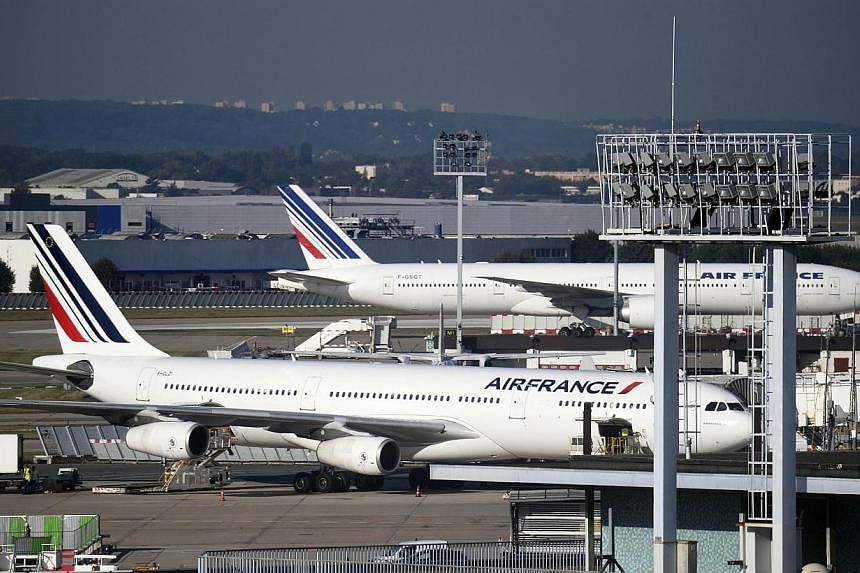 Air France planes parked on the tarmac at Orly's airport, near Paris on Sept 18, 2014. -- PHOTO: AFP