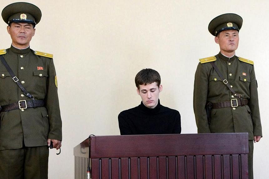 &nbsp;A file handout picture taken on Sept 14, 2014, and released by North Korea's official Korean Central News Agency (KCNA) shows US citizen Matthew Miller (centre), who was sentenced six years hard labour for "hostile" acts against Pyongyang, at N