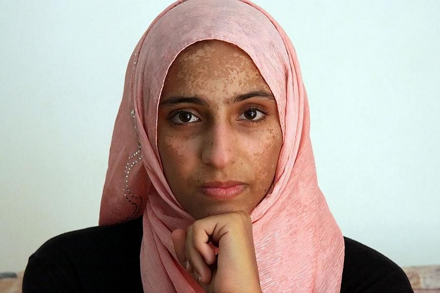 Syrian survivor Doaa Al Zamel talks to AFP on Sept 17, 2014 in an appartment at the port town of Chania on the southern Greek island of Crete. -- PHOTO: AFP
