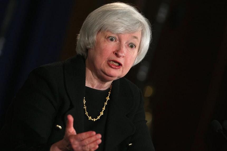 Federal Reserve Board Chairman Janet Yellen speaks to the media during her monthly news conference at the Federal Reserve on Sept 17, 2014 in Washington, DC. -- PHOTO: AFP