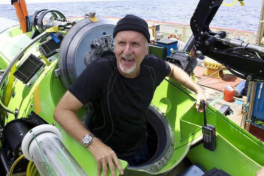 James Cameron (above) emerging from the submersible Deepsea Challenger after his solo dive into the desert-like bottom of the Marianas. -- PHOTO: MARK THIESSEN FOR NATIONAL GEOGRAPHIC