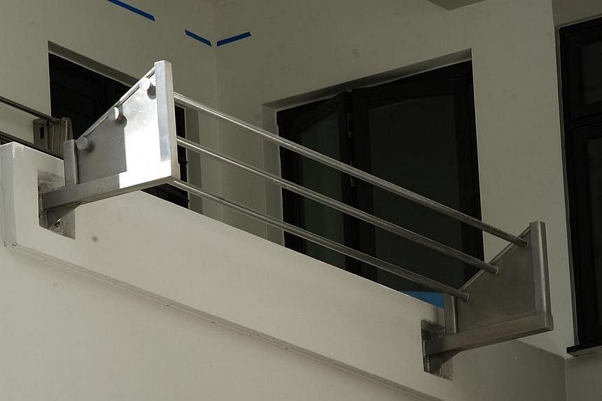 The judge said HDB's rack (above) does not act as a safety rail to stop someone from falling out of the window - a key feature of Mr Yiap's patent.