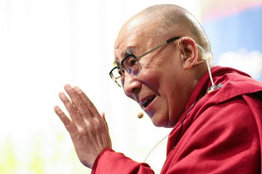 Tibetan spiritual leader Dalai Lama gives a lecture on Aug 23, 2014 in Hamburg. -- PHOTO: AFP