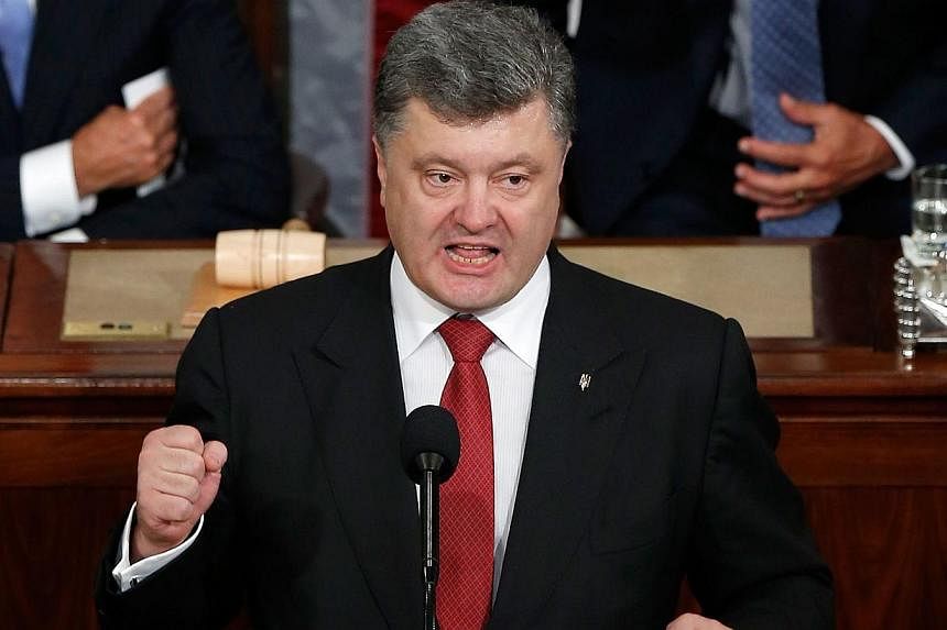 Ukrainian President Petro Poroshenko addressing a joint meeting of the US Congress on September 18, 2014 at the US Capitol in Washington, DC. The US pledged US$53 million (S$67 million) in fresh aid to Ukraine on Thursday in a gesture of support for 