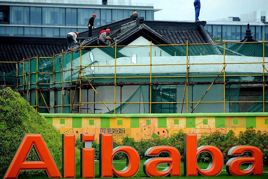 Workers renovate a building at the Alibaba head office in Hangzhou, Zhejiang province, on Sept 15, 2014.&nbsp;Alibaba Group Holding's initial public offering on Friday on the New York Stock Exchange looks set to make it as one of one of the largest I