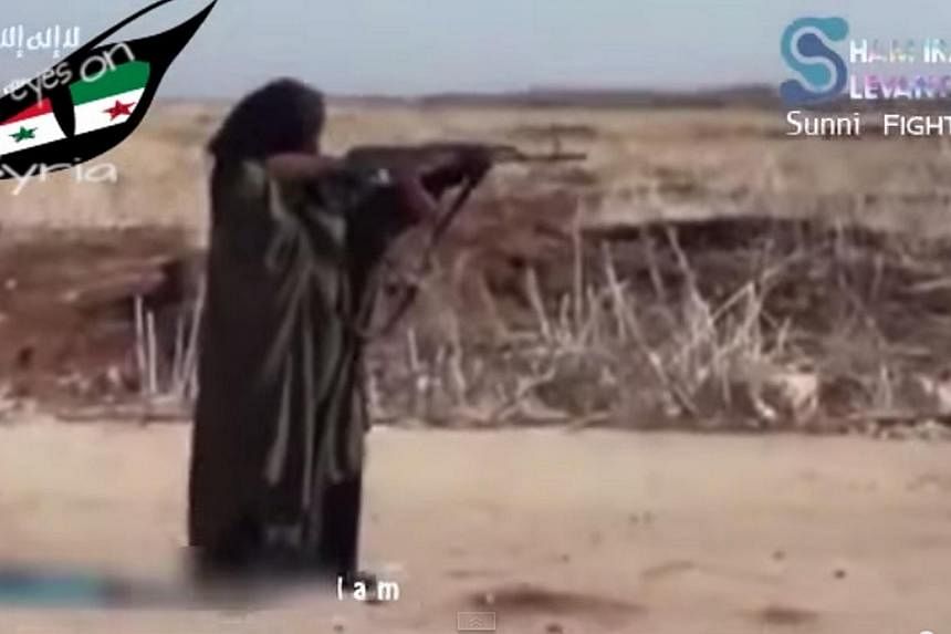 An ISIS woman fighter training with an AK-47 rifle in Ar-Raqqah, Syria. Experts believe terrorist groups are making concerted efforts to bring more women into their fold, hence counter-terrorism efforts need to be carefully tailored to ensure they re