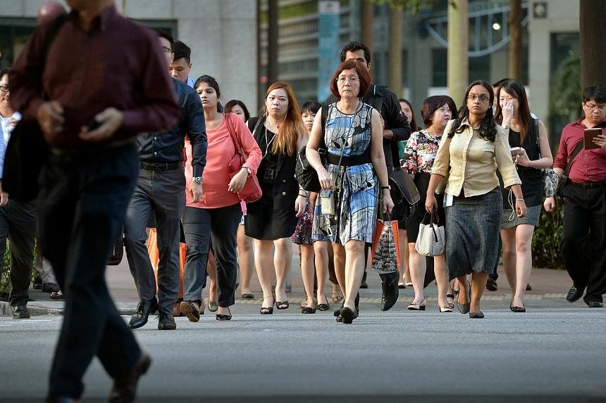 Office workers in the central business district (CBD).&nbsp;Women in Singapore are not as well represented in the workplace compared with other Asian markets, despite its position as an international hub, found a new report. -- PHOTO: ST FILE