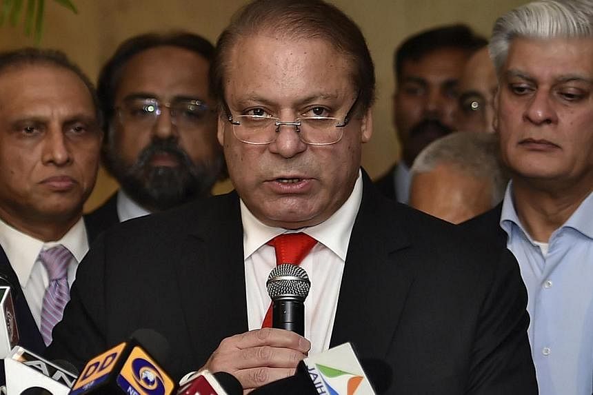 Pakistan's Prime Minister Nawaz Sharif speaks with the media during a news conference in New Delhi in this May 27, 2014 file photograph. A Pakistani accountability court on Friday dismissed two long-standing corruption cases against Mr Sharif and his