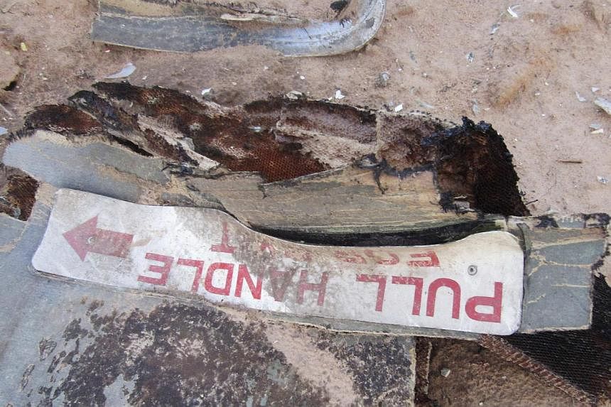 Debris is seen at the crash site of Air Algerie flight AH5017 near the northern Mali town of Gossi, July 24, 2014.&nbsp;Investigators probing the crash that killed 116 people in July said on Saturday there was no obvious lead yet and all possibilitie