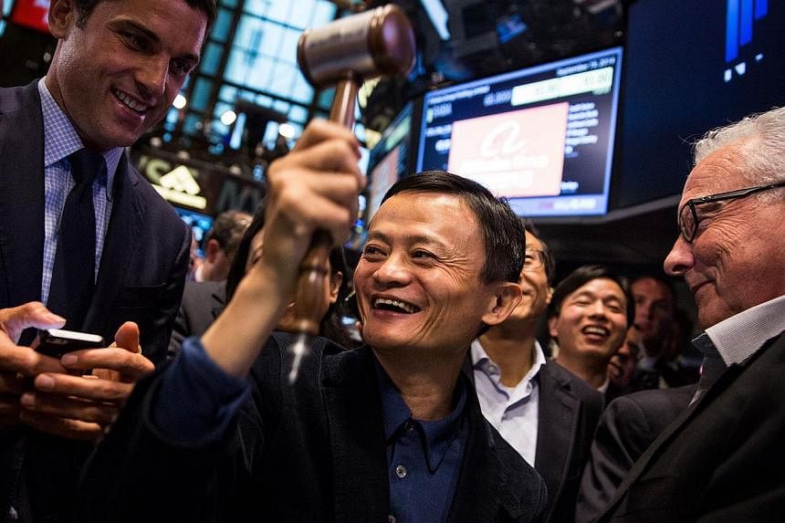 Founder and executive chairman of Alibaba Group Jack Ma celebrates as the Alibaba stock goes live during the company's initial public offering at the New York Stock Exchange on September 19, 2014 in New York City.&nbsp;Alibaba shares vaulted higher i