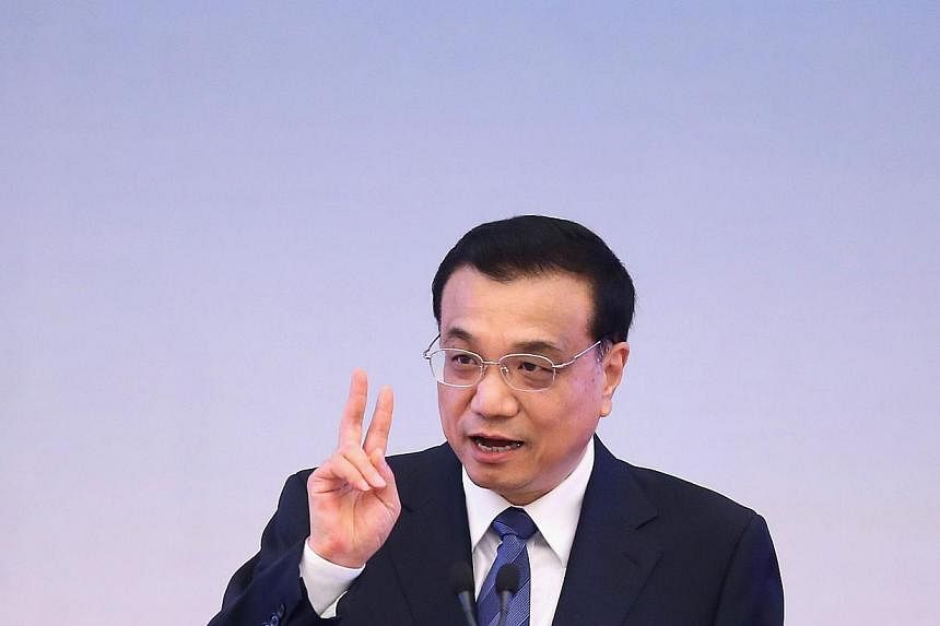 China will continue leading a prudent monetary policy with focus on targeted easing measures, Premier Li Keqiang said, according to a statement published on a central government website. -- PHOTO: AFP
