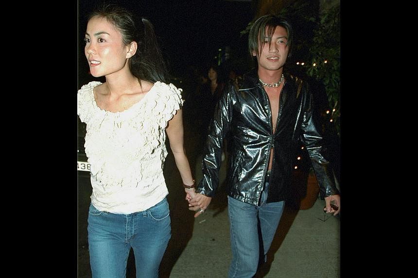 A file photo of Faye Wong and Nicholas Tse leaving a party. They&nbsp;have got back together, 11 years after they broke up and went on to marry and divorce other people, say Chinese and Hong Kong reports. -- PHOTO: APPLE DAILY