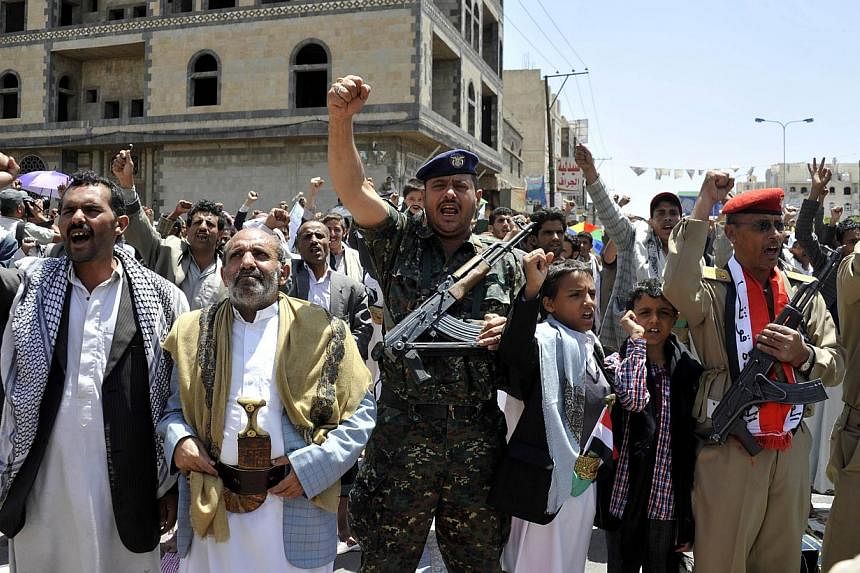 Yemeni supporters of Shi'ite rebels chant slogans during a rally in the capital Sanaa on September 19, 2014.&nbsp;International airlines suspended flights to Yemen as a decade-old rebellion encroached on the capital and a UN envoy scrambled to thrash