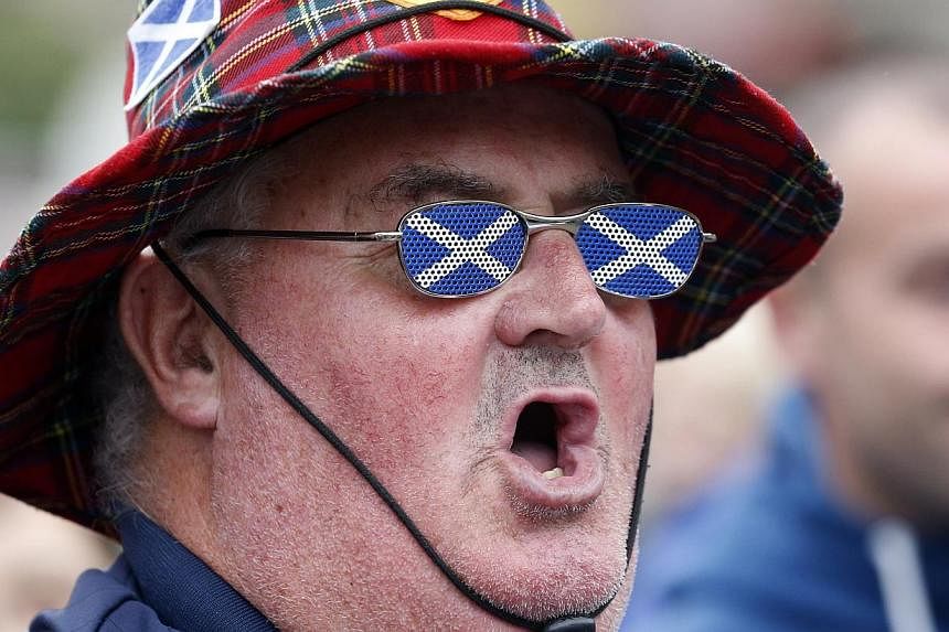 A supporter of Scottish independence makes his allegiance plain in Glasgow on Sept 19, 2014. -- PHOTO: REUTERS