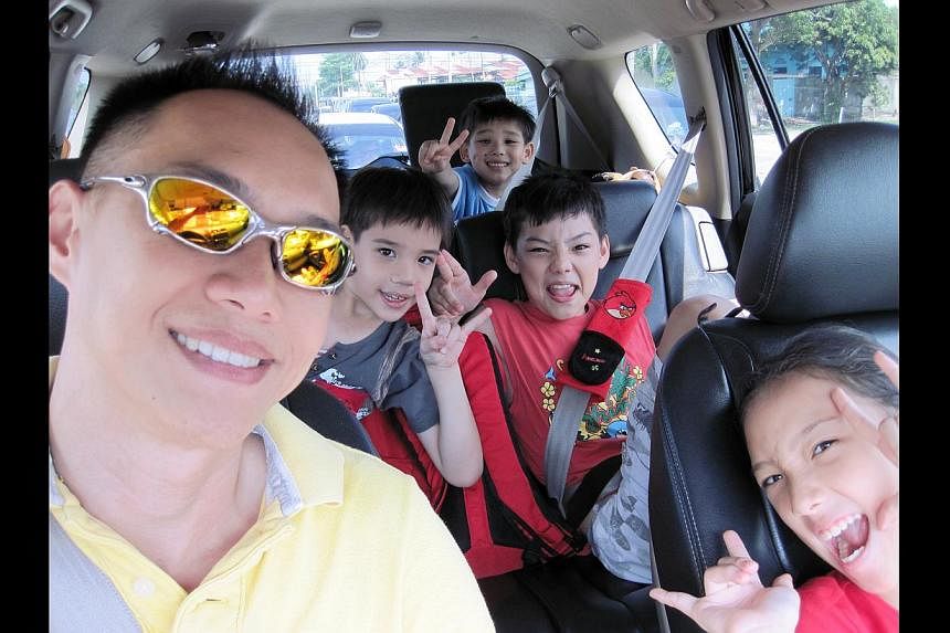 Welcome to Wayne's world: Mr Toh says his biggest challenge is meeting the individual wants and needs of his four children. Mr Wayne Toh with three of his four children (from left) Elliot, Ethel and Tertius. Mr Toh's life went into a harrowing spin w