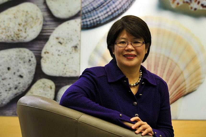 Ms Goh Swee Chen, a vice-president at Shell, was born in Batu Pahat, Johor, and saved up in her teens to study overseas. She became a Singaporean in 2007. -- ST PHOTO: DESMOND FOO