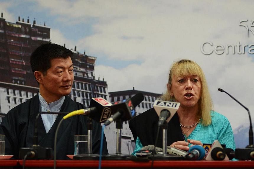 Nobel Peace Prize laureate Jody Williams (R) speaks as the Sikyong, or Prime Minister of the exiled administration, Lobsang Sangay looks on during a press conference to mark 25 years since the Dalai Lama was awarded the Nobel prize at the Central Tib