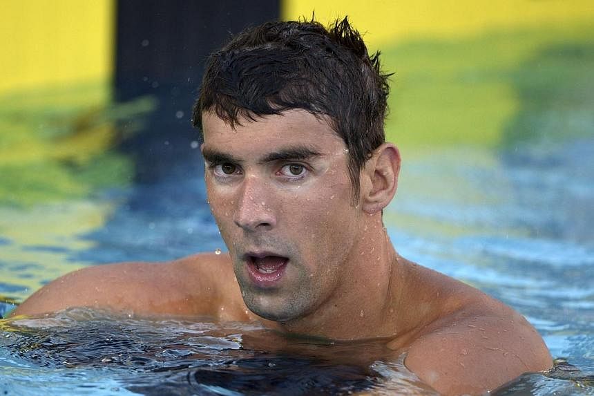 Michael Phelps reacts after placing seventh in the 100m freestyle in the 2014 USA National Championships in Irvine, California, in this file photo taken on Aug 6, 2014. -- PHOTO: REUTERS