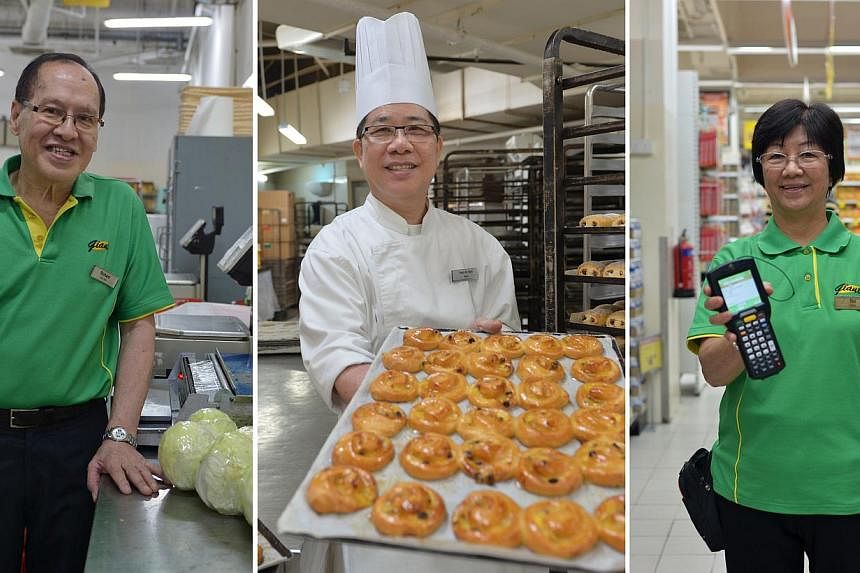 GOING STRONG AT GIANT: (From left) Mr Wong Kee Hua, 67, sorts and labels vegetables in Giant Hypermart at IMM; Mr Teoh Ah Kian, 62, is a baker; and Ms Teo Siam Sing, 65, is a sales assistant. Some older workers hope their employers will continue to o