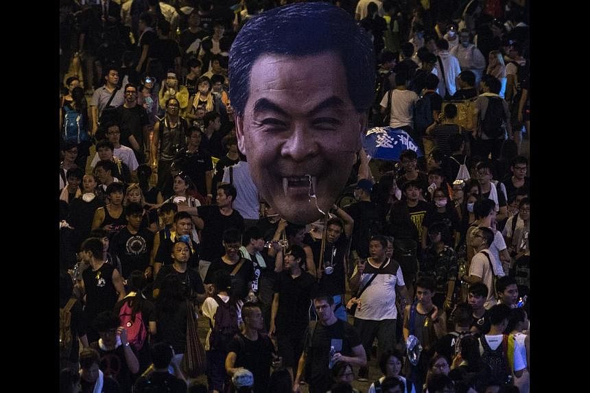 Hong Kong protesters with an effigy of Chief Executive Leung Chun Ying on Monday. Over the next few days, the world's eyes will be on the streets of Hong Kong and how the government of Beijing handles the crisis.