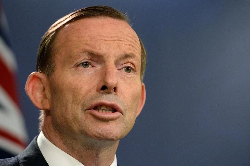 Australia's Prime Minister Tony Abbott speaks at a press conference in Sydney on Sept 19, 2014. -- PHOTO: AFP