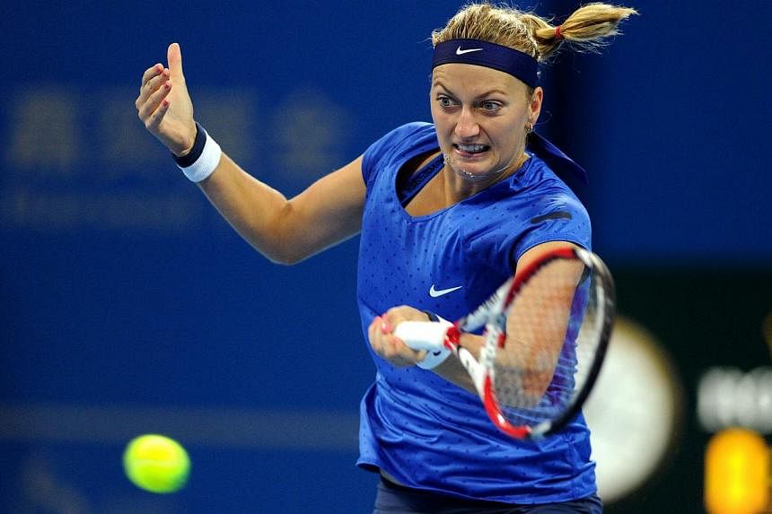 Petra Kvitova of Czekh returns a shot to Shuai Peng of China during their women's singles second round match at the China Open tennis tournament in the National Tennis Center of Beijing on Oct 1, 2014. -- PHOTO: AFP