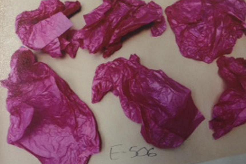 Pink tissue paper, which was presented as evidence in the trial of Luka Magnotta, is seen in this picture rovided by Montreal Police on Sept 30, 2014. -- PHOTO: REUTERS&nbsp;